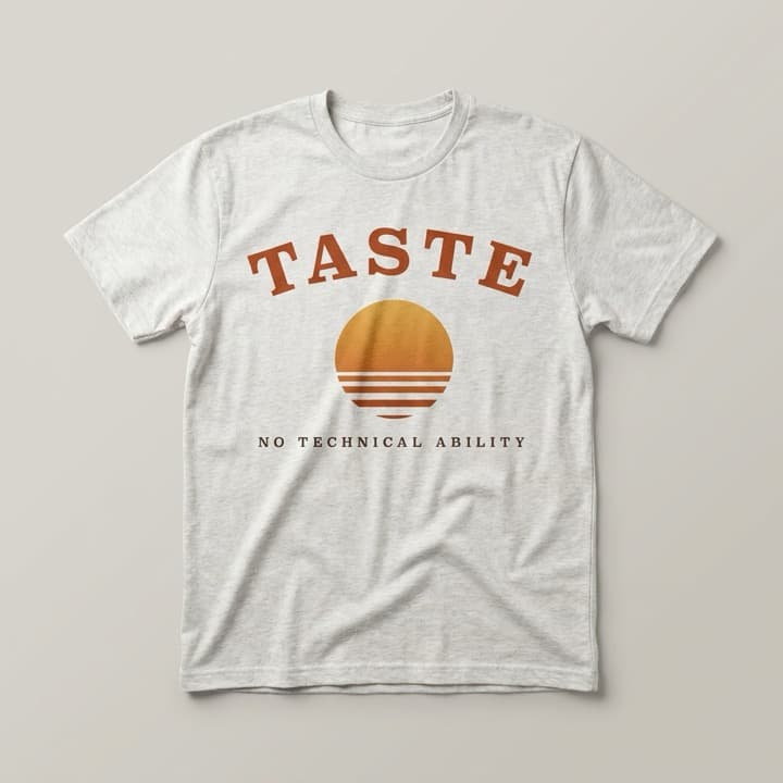 Ash-white t-shirt printed with an arched TASTE over a striped sunset, and NO TECHNICAL ABILITY beneath